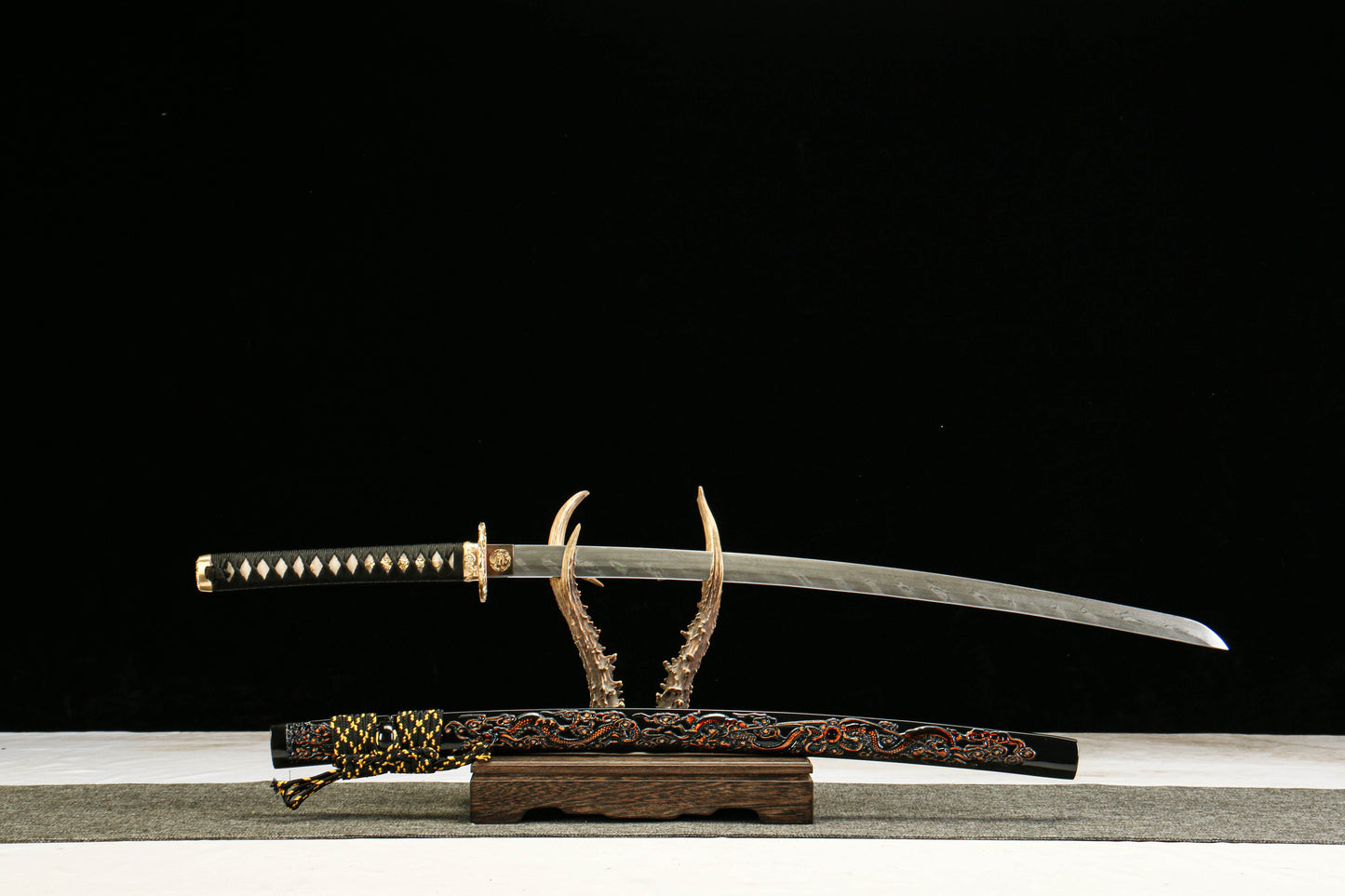 Damascus Steel Twisted Pattern Blade Katana with Brass Fittings and Black Lacquered Scabbard Featuring a Golden Dragon Design