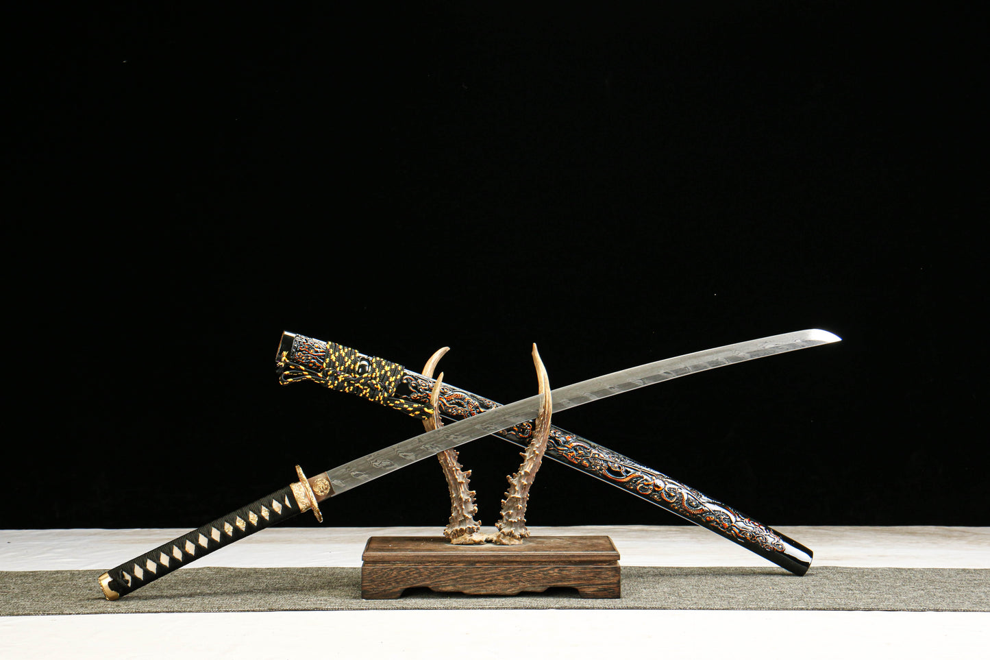 Damascus Steel Twisted Pattern Blade Katana with Brass Fittings and Black Lacquered Scabbard Featuring a Golden Dragon Design