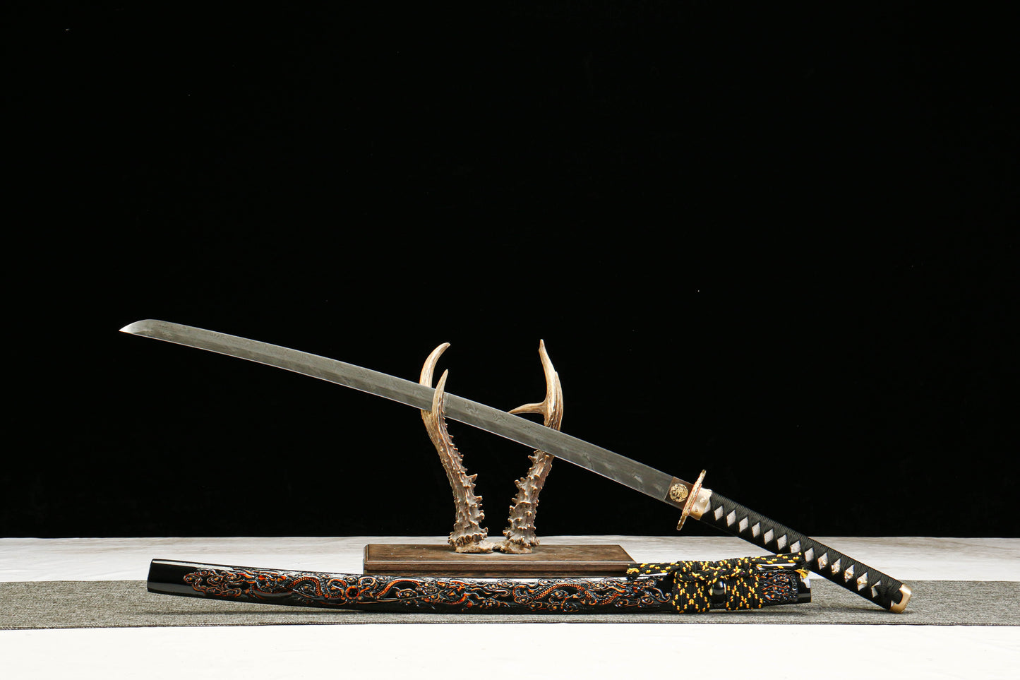 Damascus Steel Twisted Pattern Blade Katana with Brass Fittings and Black Lacquered Scabbard Featuring a Golden Dragon Design