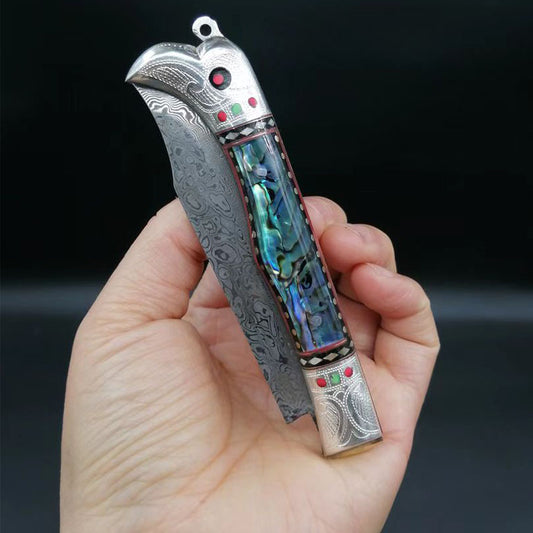 Pigeon head silver handle abalone carved folding knife