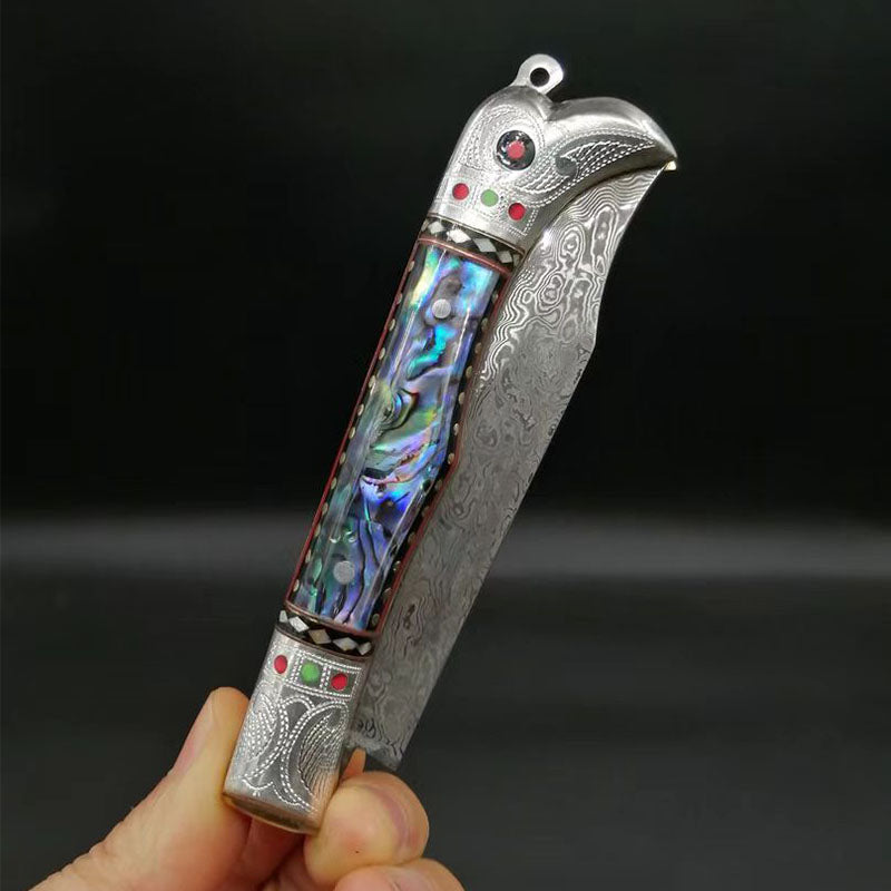 Pigeon head silver handle abalone carved folding knife